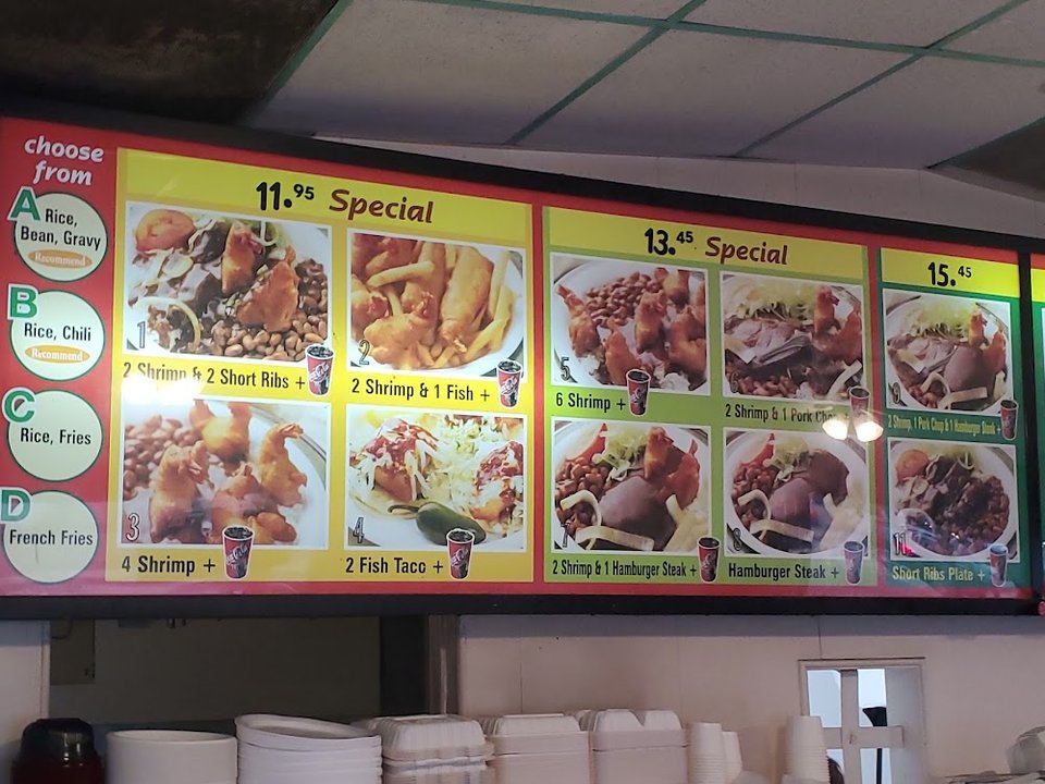 Restaurant menu highlighting tacos, salads, and shrimp.